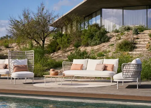 CURIO Sofa in an outdoor lounge, surrounded by natural landscaping.