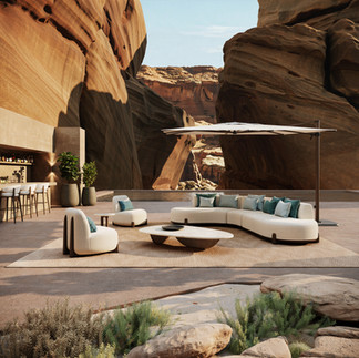 Coco Wolf Paloma curved outdoor lounge setting with cream upholstery, shade umbrella and sculptural rock landscape.
