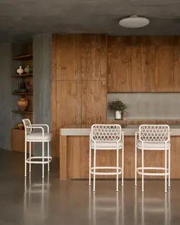 CURIO Bar Stools placed by kitchen, blending with contemporary decor.