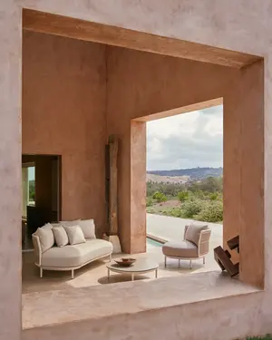 Amba Sofa with woven backrest in Mineral White finish and weatherproof cushions.