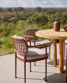 CURIO Dining Chairs positioned on a stylish outdoor deck.