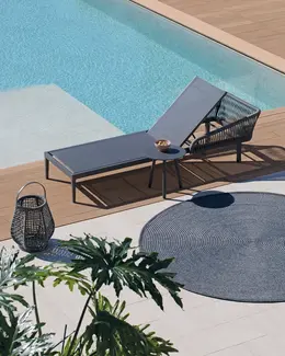 MICHELANGELO Outdoor Rug – Shown under outdoor furniture in a high-end residential setting.
