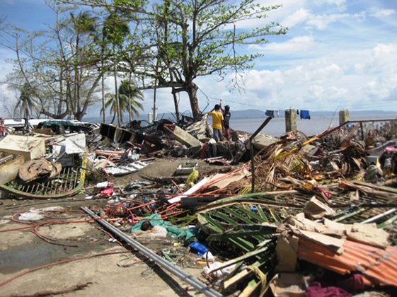 People search through the ruins for anything salvageable..png