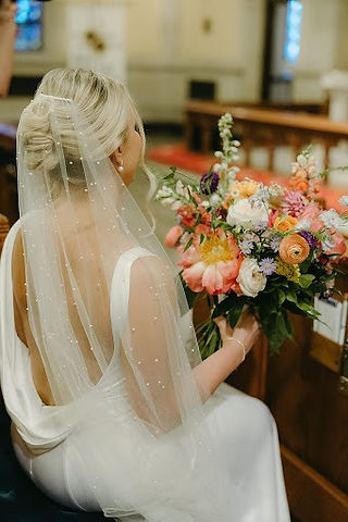 bride sitting at pew