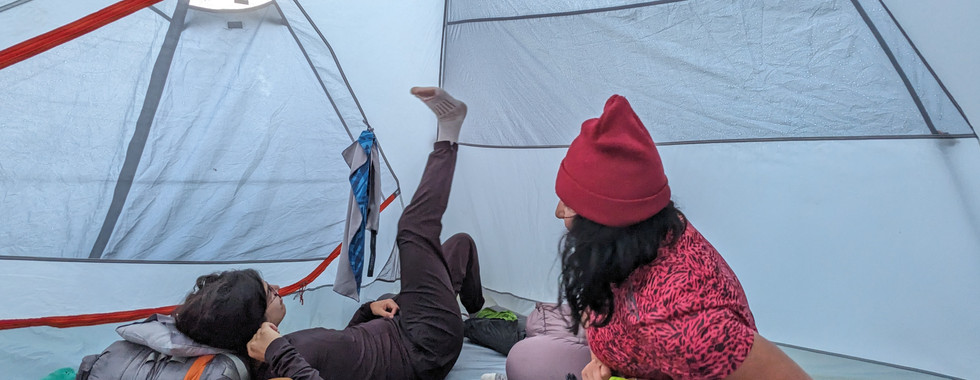 Women hanging out in a tent