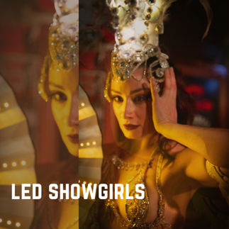 A beautiful showgirl dancer in the moment performing in Sydney for an event dressed with glowing LED headdress