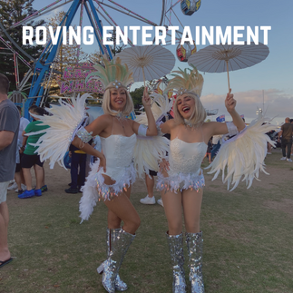 two roving entertainers dressed in white fetahered costumes at festival in central coast