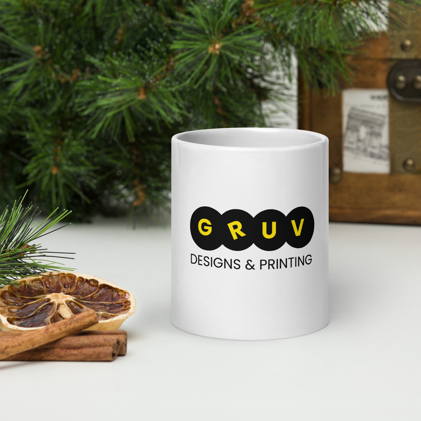 A clean white ceramic mug sitting on a wooden surface