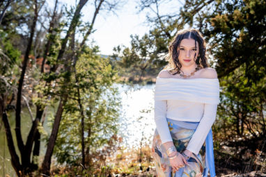 Individual portrait by the water during a mountain session in Southern New Mexico