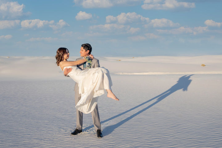 Couple posing together during a scenic portrait session at White Sands National Park