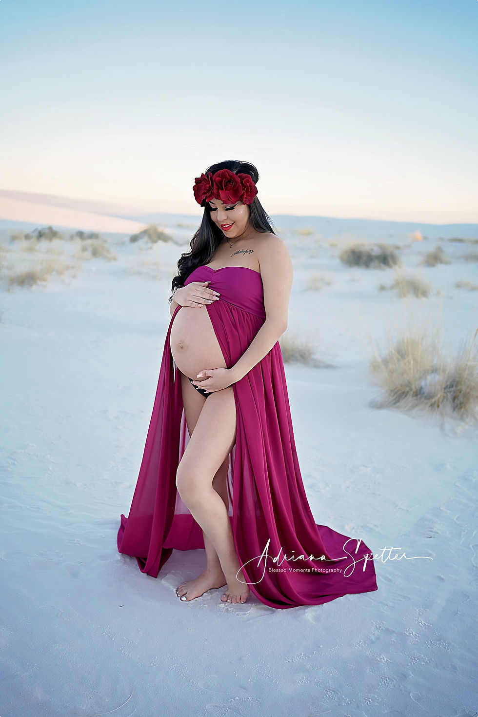 Happy mama holding her belly in Maternity photo