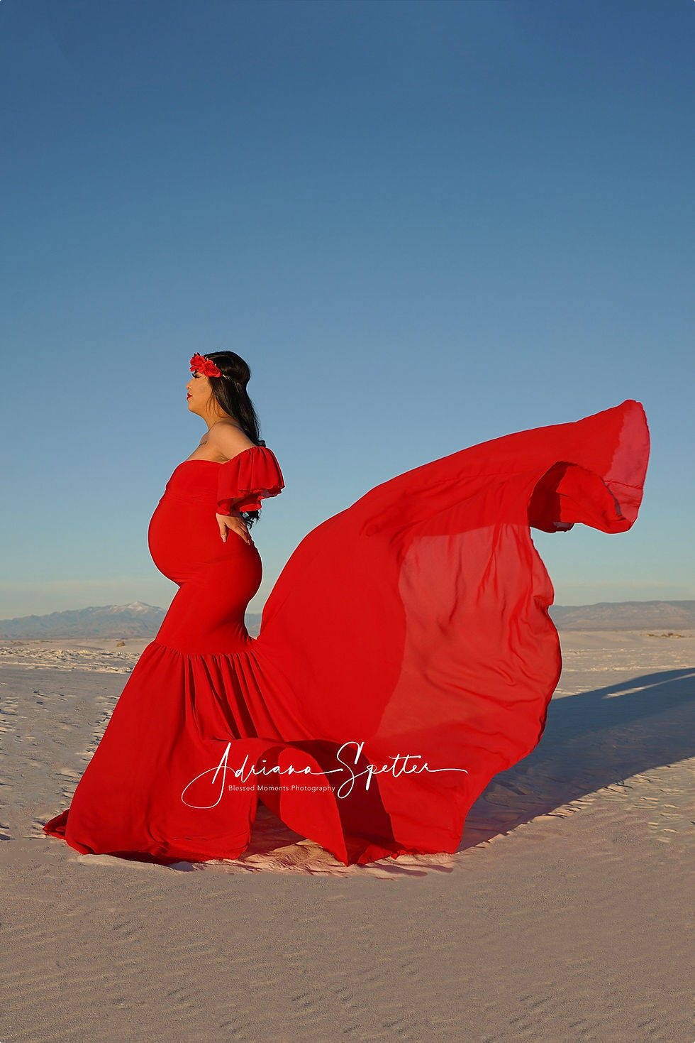 Red dress flowing at White Sands National Park.