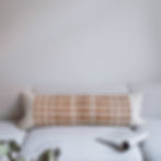 wool and jute lumbar cushion on white sofa