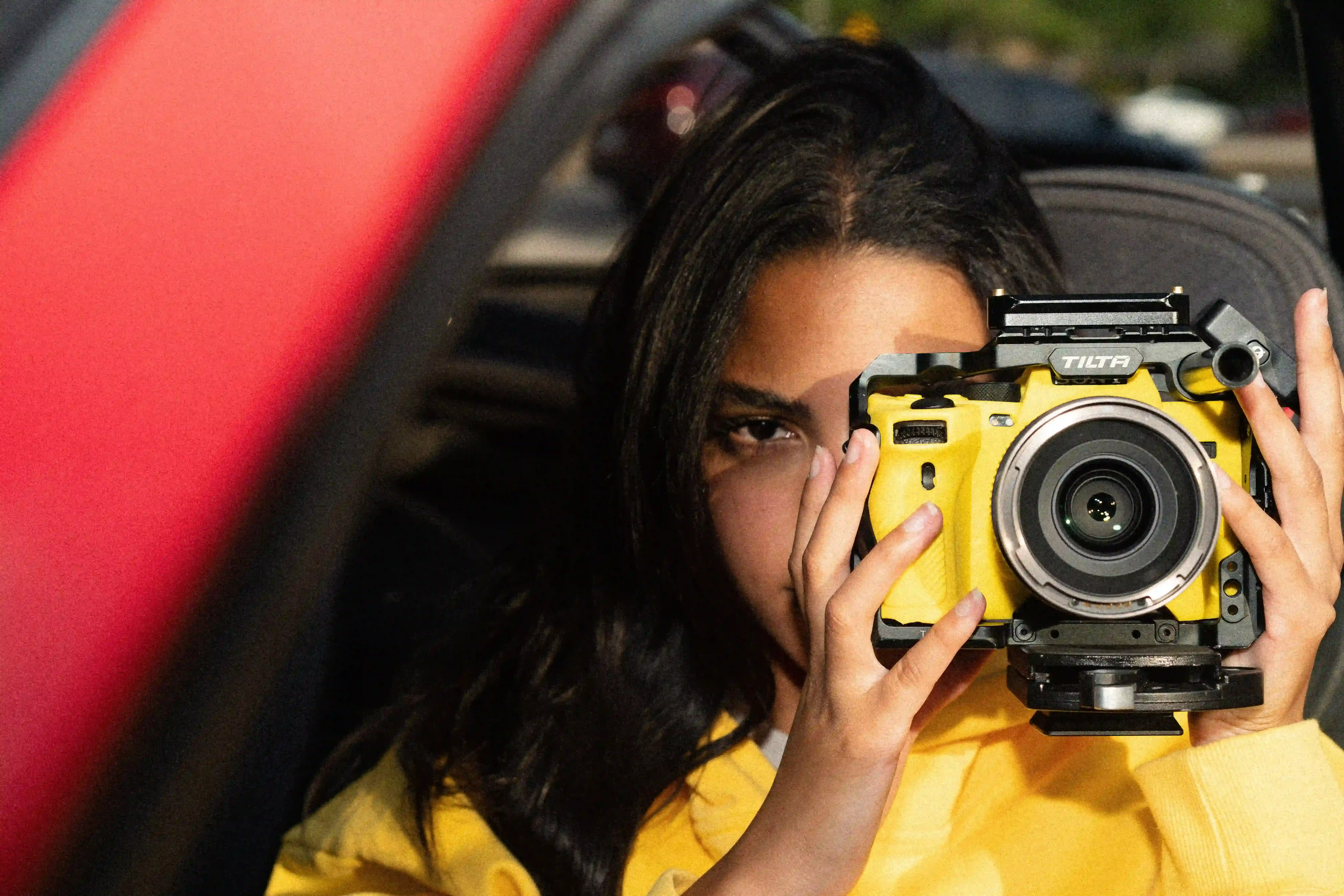 girl with yellow camera