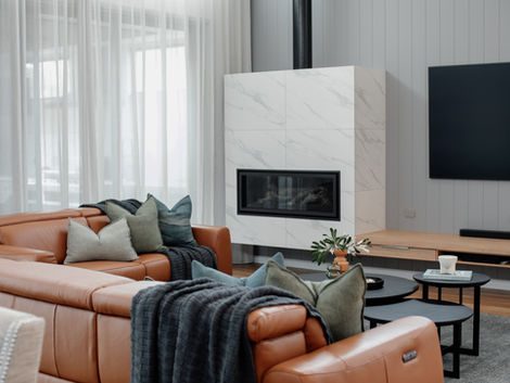 Collaborating with a local custom builder, this modern home was designed to make a statement!
A breathtaking entrance showcasing a gloss wood timber lined ceiling, feature pillars clad in multicolored ‘crazy’ veneer stone and contemporary black exterior lighting.
The interior colour palette emulates a neutral yet cohesive scheme with spotted gum vinyl flooring throughout, warm ‘aura’ white walls, natural stone inspired floor and wall tiles, cool white veined reconstituted stone bench tops and custom timber laminate cabinetry.
Bold accents are evident within the accent interior light fixtures, window furnishings hardware, moody ‘stormcloud’ joinery and sleek cabinetry handles complimented by brushed nickel plumbing fittings and fixtures.
Soft green and grey hues painted on vertical paneled walls with textural s-fold sheer curtains throughout add interest and grandeur to bedrooms and the main living/dining spaces.
The entire home is elevated with an alfresco designed for all season entertaining with an enclosed dining area equipped with adequate heating for winter nights and a large pool with spa to enjoy long summer days and evenings under the stars!
A home built to last considering every element and important detail.