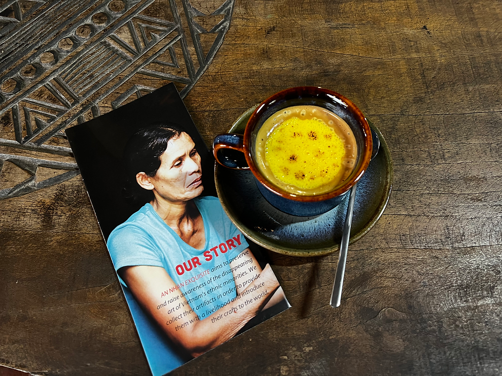 Golden turmeric latte beside Gold, Indigo, & Jasmine card