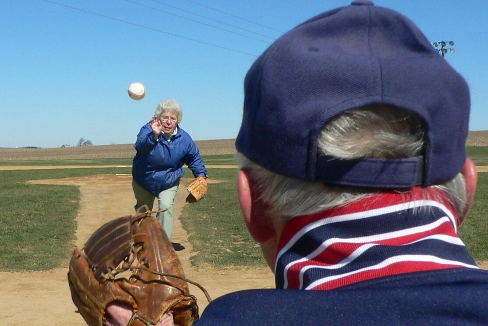 My mom throwing her fastball to my dad at the Field of Dreams.