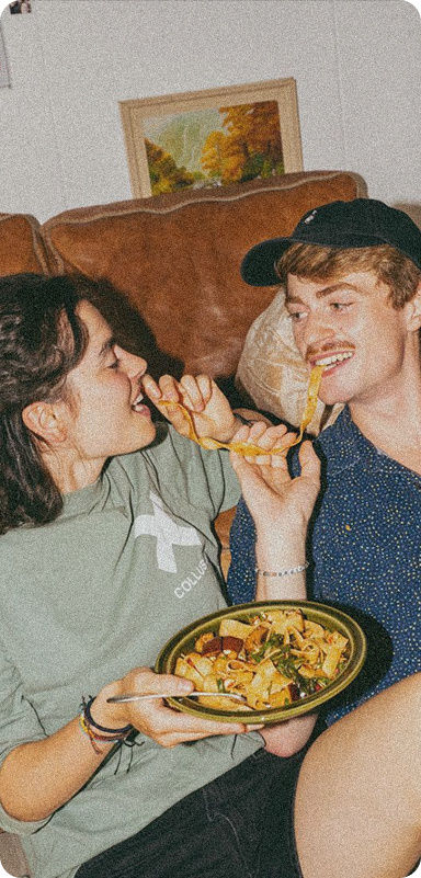 Savings goals advice: friends sharing food indoors.