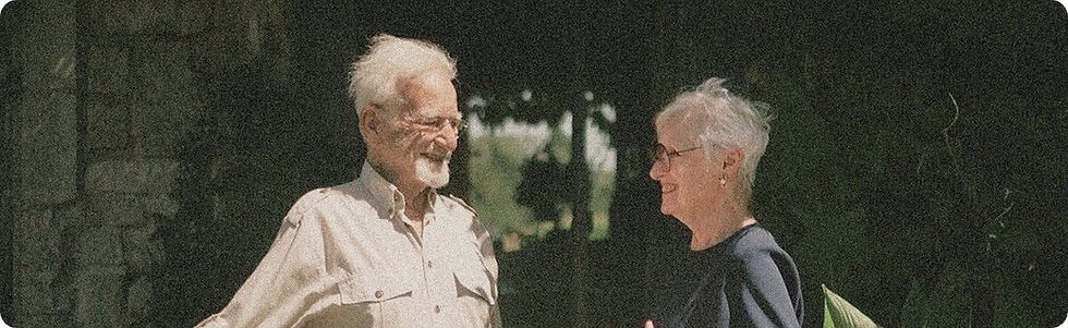 Buy-to-let calculator: older couple talking in a garden.