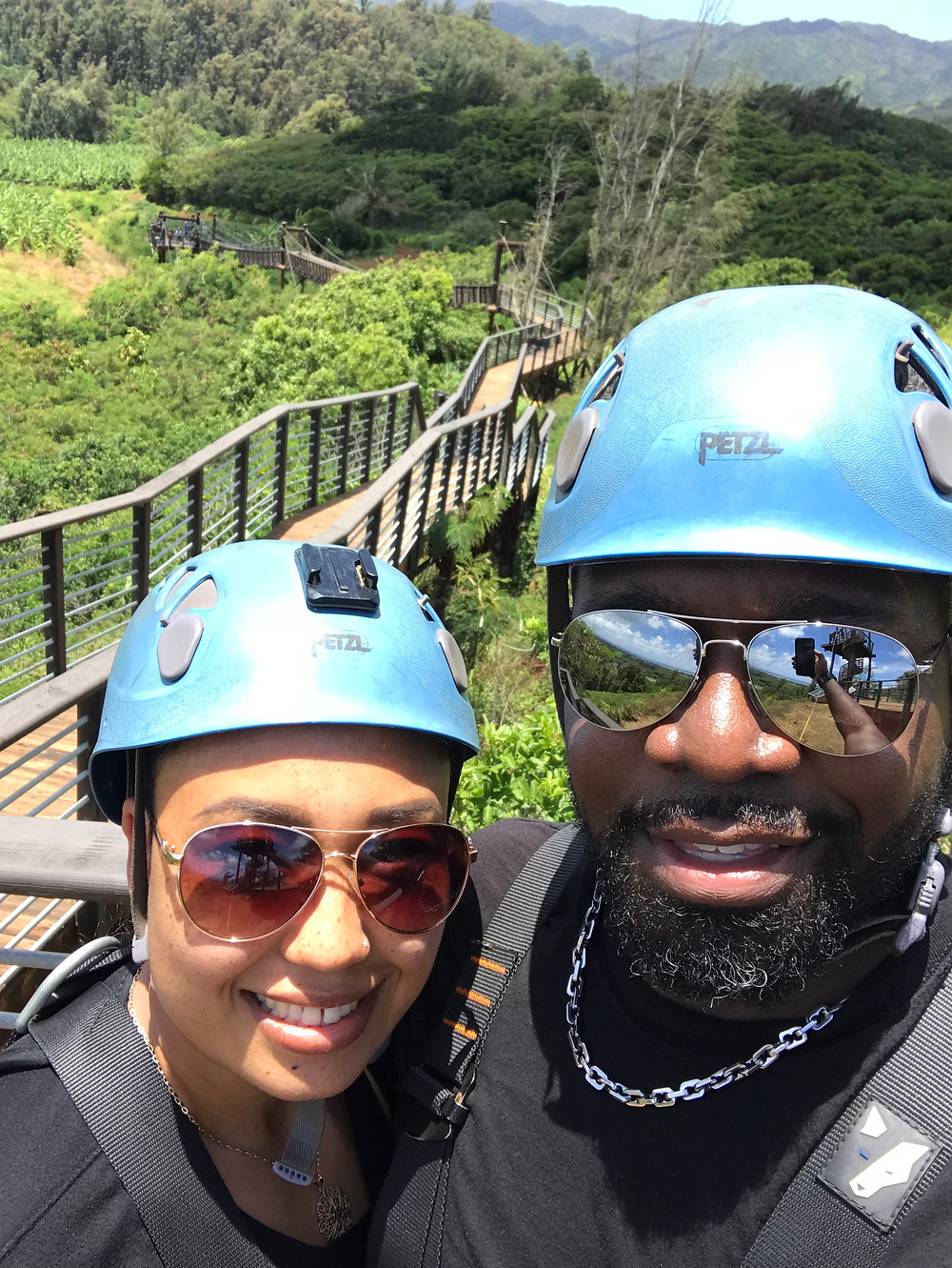 Married interracial couple zip-lining in Oahu, Hawaii