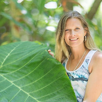 Laura in Hawaii wearing her Art T-shirt inspired by sound healing and water