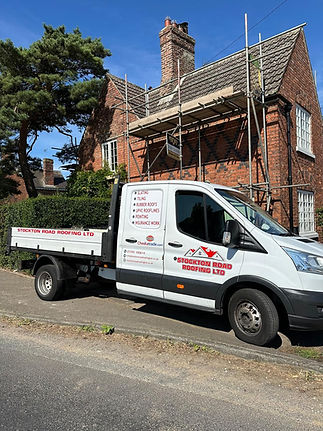 The Stockton Road Roofing van outside a home