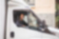 Woman in the driver's seat of a van