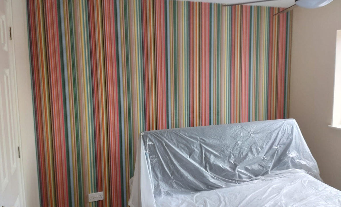 Striped wallpaper in a bedroom