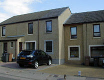 Two storey house extension in Cove Aberdeen matching the original grey masonry