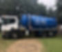 Tanker lorry parked in a field