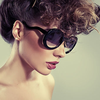 A woman in designer sunglasses