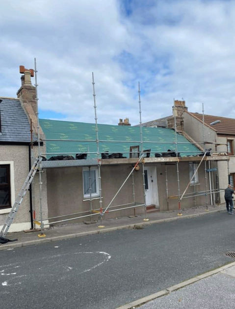Scaffolding and a temporary roof on a property