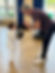 A man and very small child in karate class