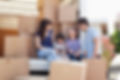 A family surrounded by boxes