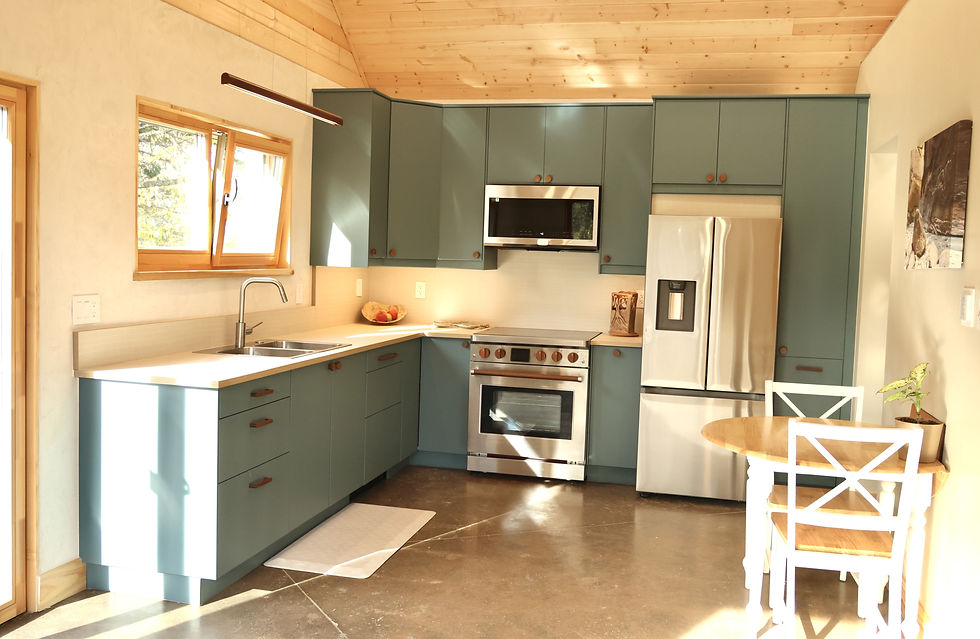 The colorful kitchen, with French doors opening onto the garden. Photo: Full Life Photography.