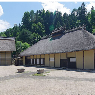 The Former Nakamura Family Residence, a large thatched-roof timber farmhouse built in 1698 in Miasa, Nagano, Japan.