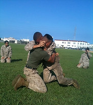 Mike Del Angel participating in military combatives training outdoors while serving in the United States Marine Corps.