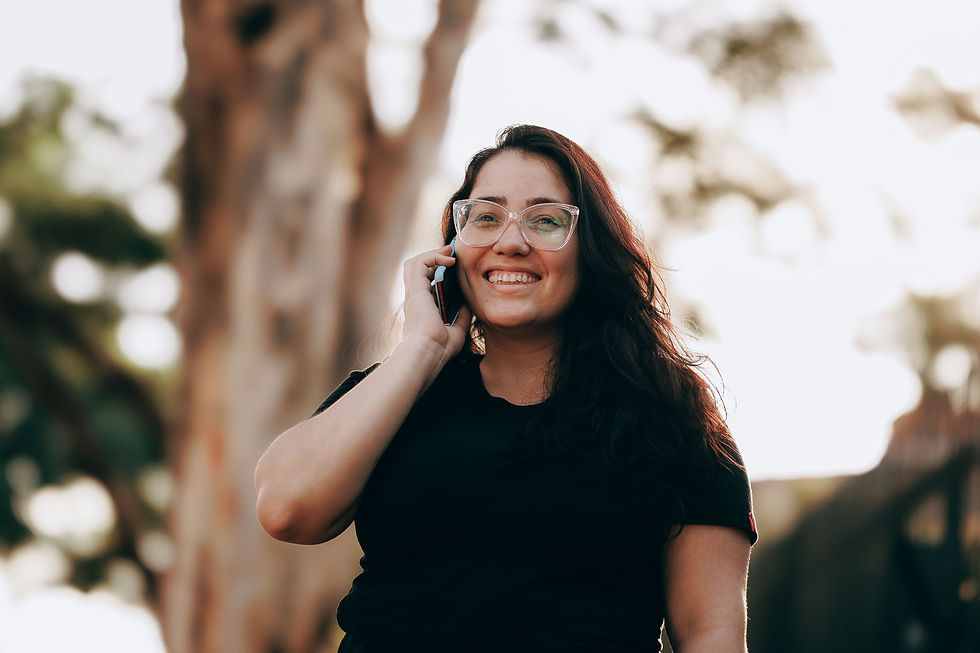 Girl with glasses on talking on the phone
