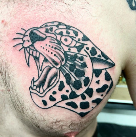 A tattoo of a tiger on pecs





