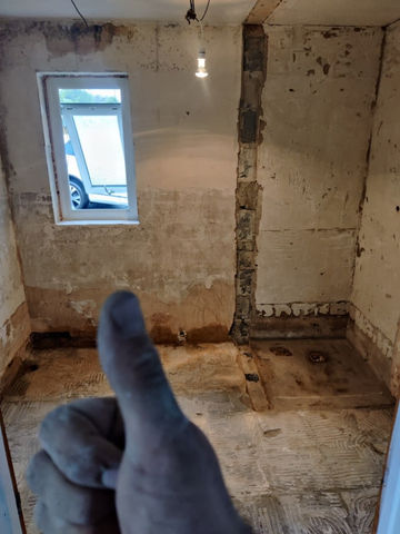 View of an bathroom after removing the fittings