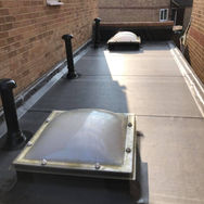 Flat rooftop with two dome skylights