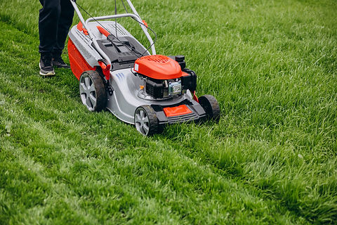 A man using a lawnmower