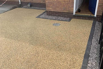 View of a light brown resin-bound lawn paver