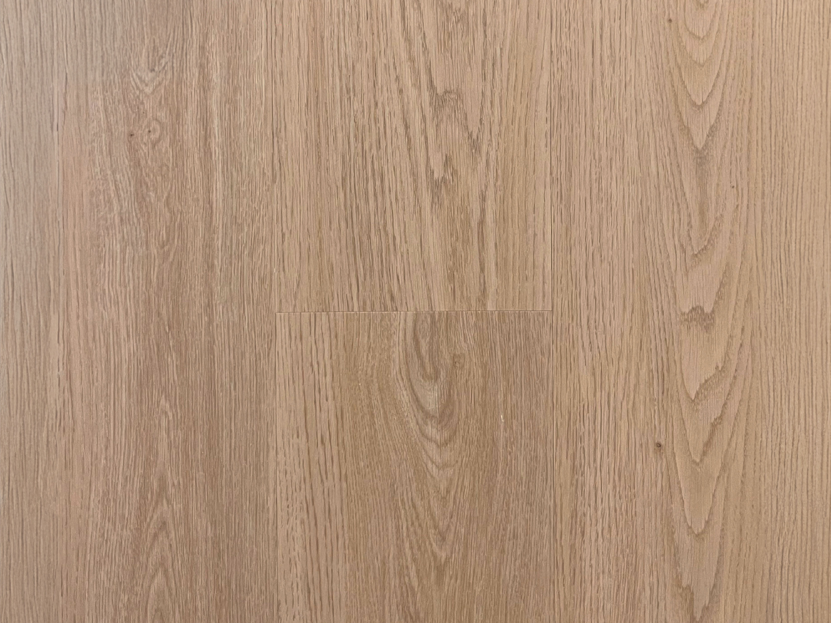 Lagoon BP710 SPC flooring swatch showing a light sandy wood tone with soft beige undertones and subtle, linear wood grain.