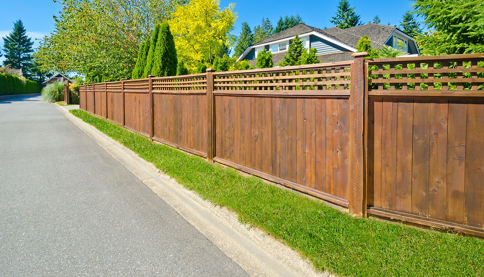 Large wooden fence with decorative top