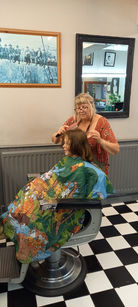 Child getting their hair cut