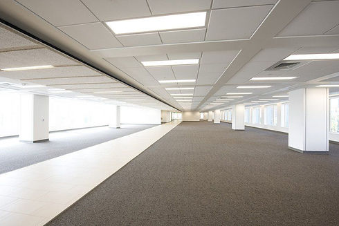 Long, empty office with a suspended ceiling