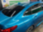 Blue car with tinted windows