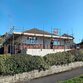 Bungalow that is having a new roof installed
