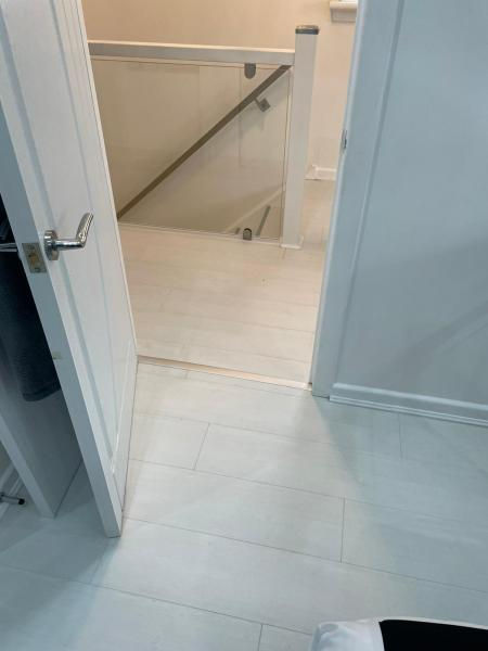 light laminate flooring in a bedroom and hallway